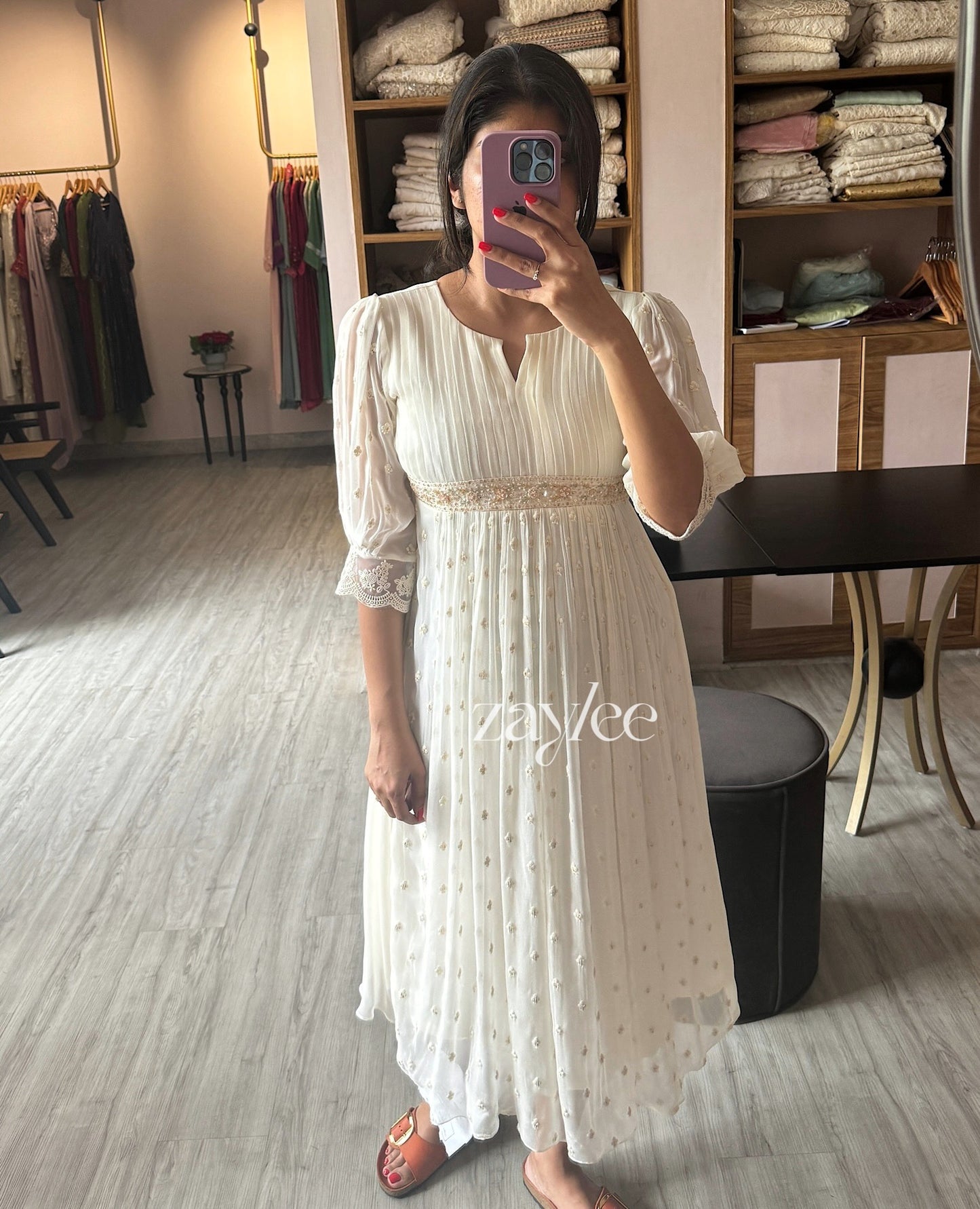 Off white pleated kurta with highlights.